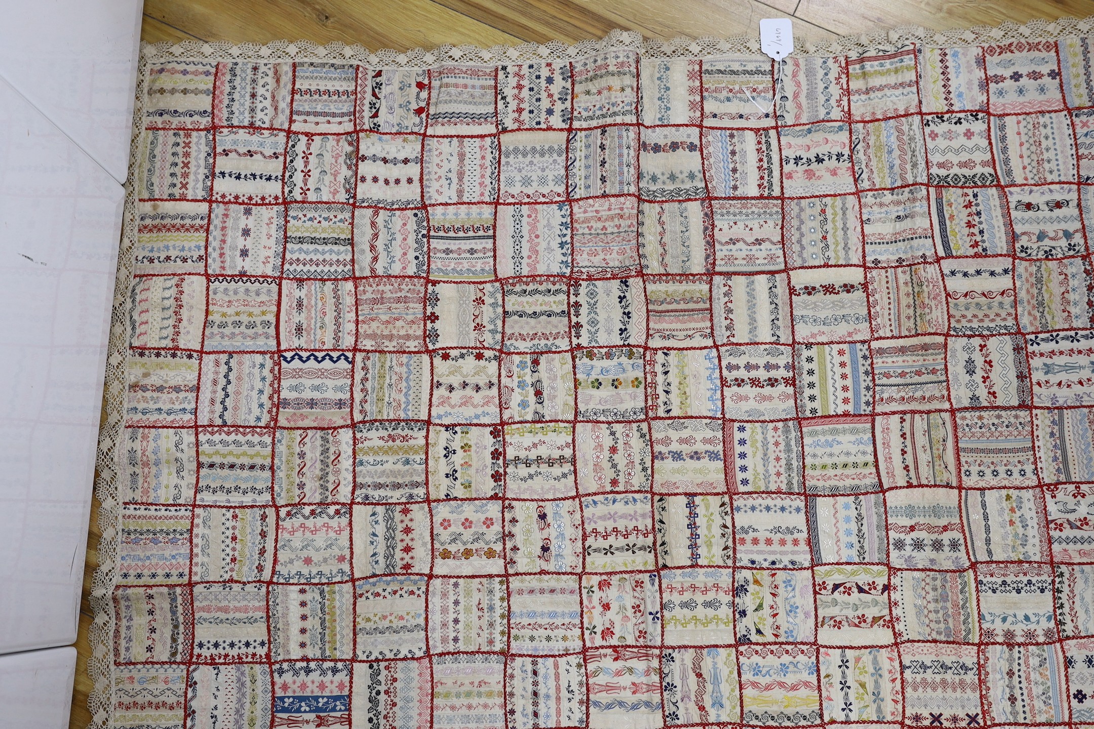 A French early 20th century ribbon patchwork cover with lace trimmimg